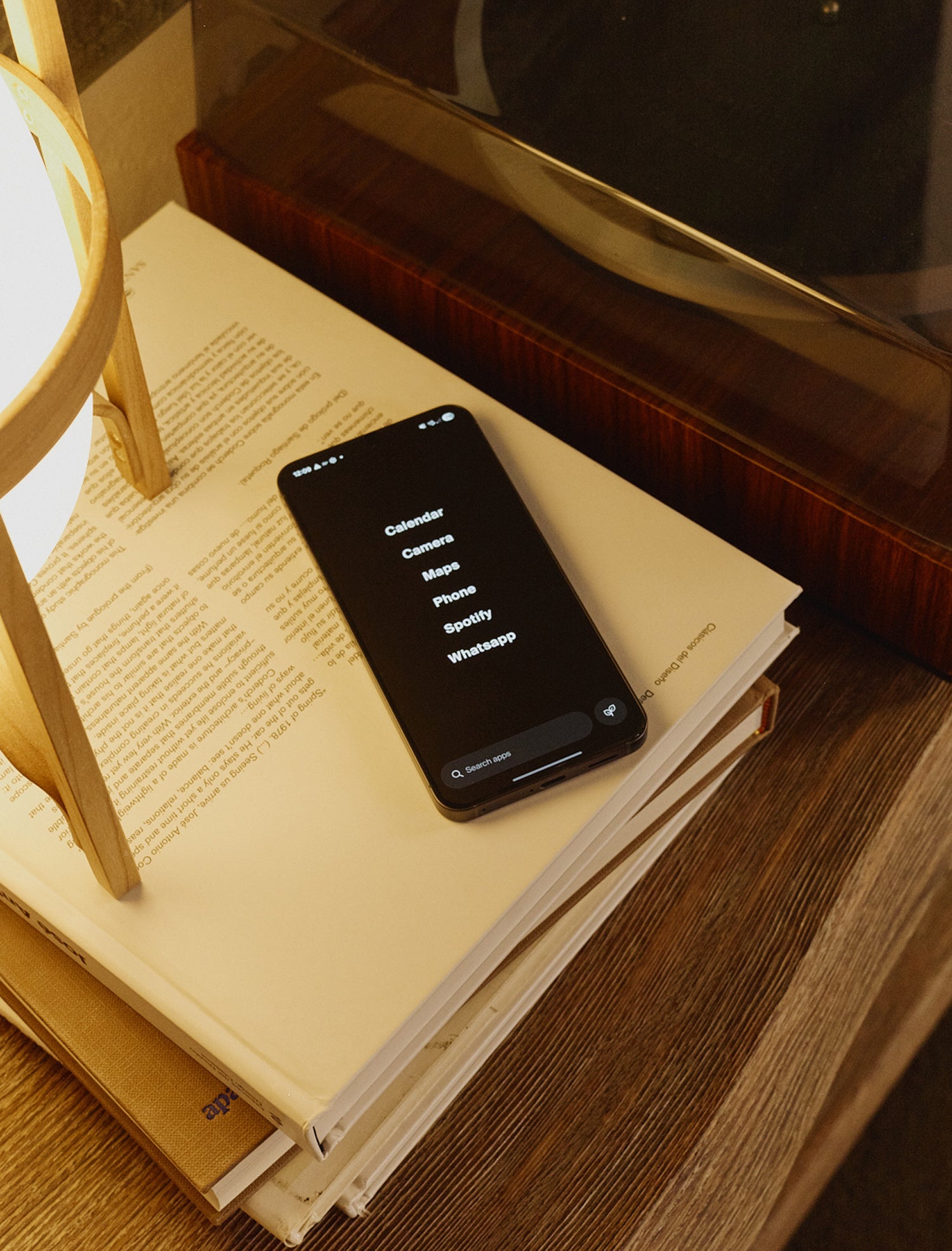 Smartphone on a stack of books with a blurred background