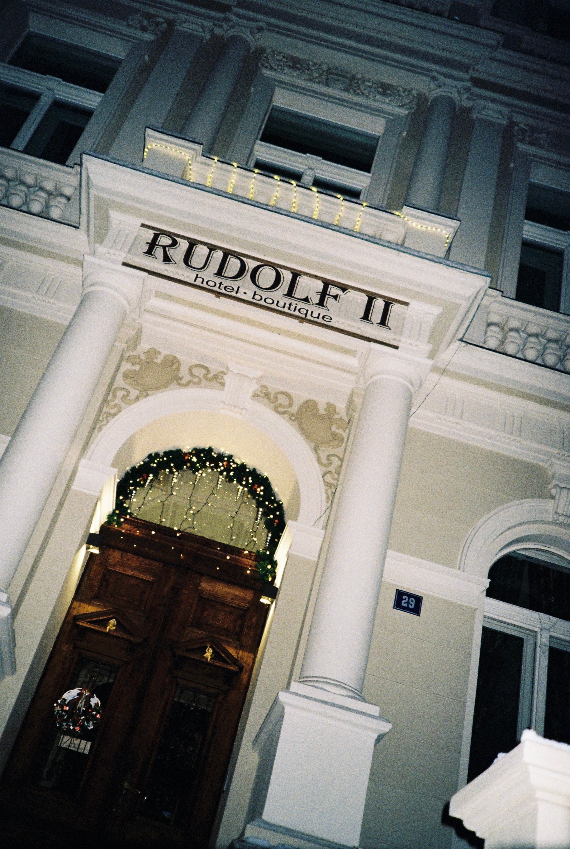 Facade of a building with 'Rudolf II' sign above entrance